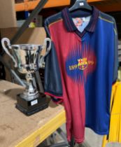 A Luis Enrique FC Barcelona football shirt size XXL and a silver coloured trophy on plinth