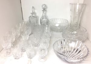 Twenty pieces of glassware including two decanters, scallop shell shape bowl 22 x 23cm,