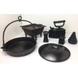 Box containing seven cast iron items including miniature stove 21x26x13cm high,