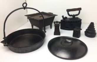 Box containing seven cast iron items including miniature stove 21x26x13cm high,