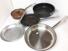 Green plastic box containing five pre-used pans including Fissler 28cm stainless induction,