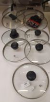 Nine mixed pot lids (saleroom location: S01-T03)