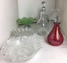 Seven pieces of glassware including three decanters,