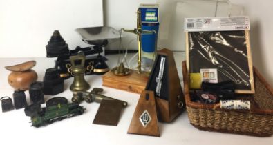 Plastic box and basket containing fifteen plus items including black and gilt metal weighing scale