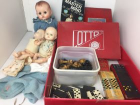 Red box containing eleven items including three vintage dolls by Pedigree 24 and 38cm tall,