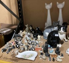 Contents to rack - two large white ceramic cats, large black,