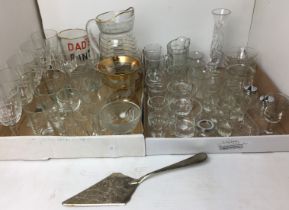 Contents to two trays - forty-five plus items of glassware and a silver plated cake slice 30cm long