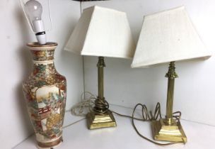 Three table lamps including pair of brass column with cream Hessian square shades 50cm high and