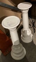 Pair of white porcelain pedestals each 60cm high and a black metal candle stand (saleroom location: