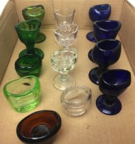Contents to tray - a collection of thirteen glass eye baths (saleroom location: Z07)