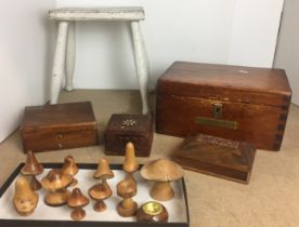 Box containing sixteen wooden items including ten toadstools made from different British trees from