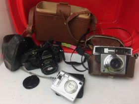 Red plastic box containing three cameras including Fujifilm F440 FinePix digital camera with case,