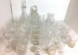 Thirty-five plus pieces of glassware including two decanters, stemmed eyebath,
