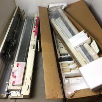 Two knitting machines -Toyota KR506 (boxed and appears unused) and Toyota KS858 portable (also