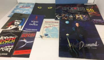 Box containing ten concert/musical souvenir programmes- Status Quo, Neil Diamond, Les Misérables,