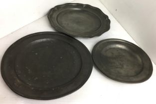 Three pewter plates (23cm, 22.5cm and 17.