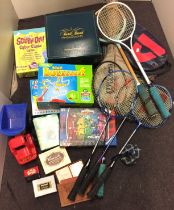Two boxes containing toys and games including Canasta, four badminton rackets,