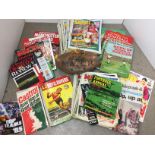 Green plastic box containing football magazines and books including Roy of the Rovers 1967 Annual,
