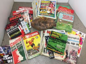 Green plastic box containing football magazines and books including Roy of the Rovers 1967 Annual,