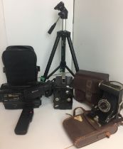 Box containing four photographic items including vintage Agfa camera with leather case,