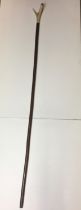 Antler thumbstick handle walking stick with brass tip 127cm long (saleroom location hung on end of: