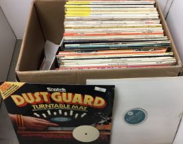 Box containing seventy plus items including Pick-Up Alignment Disc, DustGuard turntable mat,