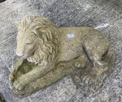 Large concrete garden ornament of a recumbent lion,