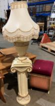 A composite cream table lamp with shade on cream composite column (total height 140cm) (saleroom