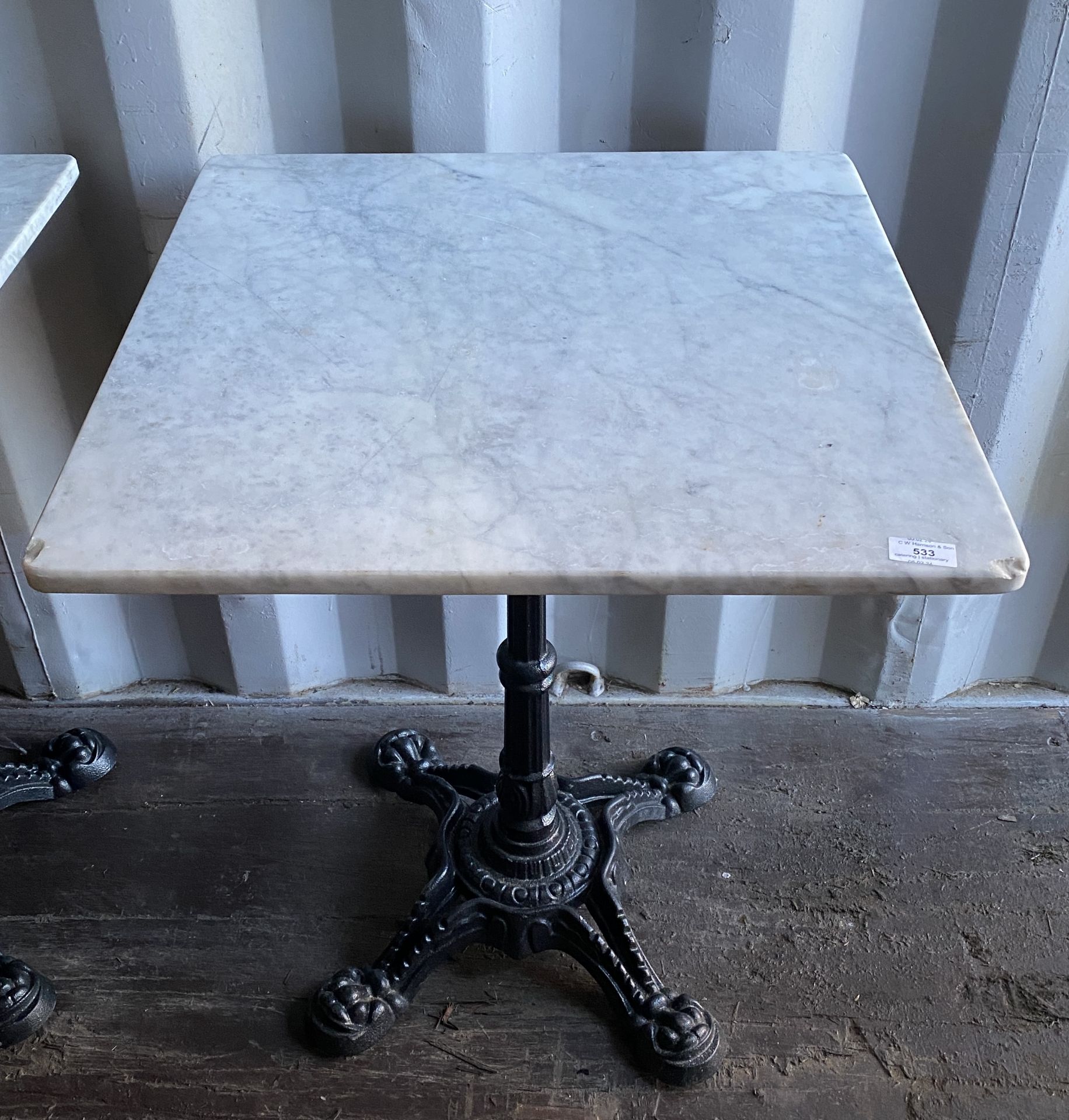 White marble-topped centre metal column square dining table,