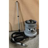 Nuvac grey cylinder vacuum with hose and foot (saleroom location: PO)