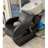 Hairdresser's backwash chair upholstered in black rexine with integral sink (will require