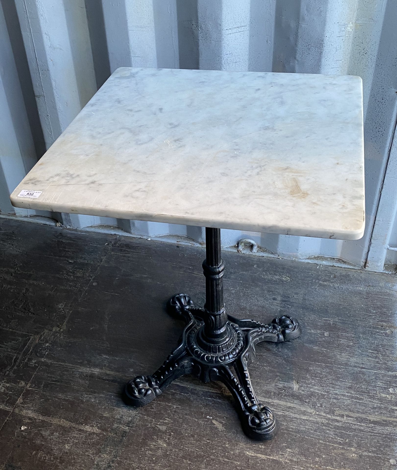 White marble-topped centre metal column square dining table,