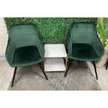 Two green reception chairs with small two-tier imitation marble side table.