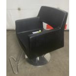 Barbers armchair in plain black rexine with imitation crocodile finish to sides with pump action