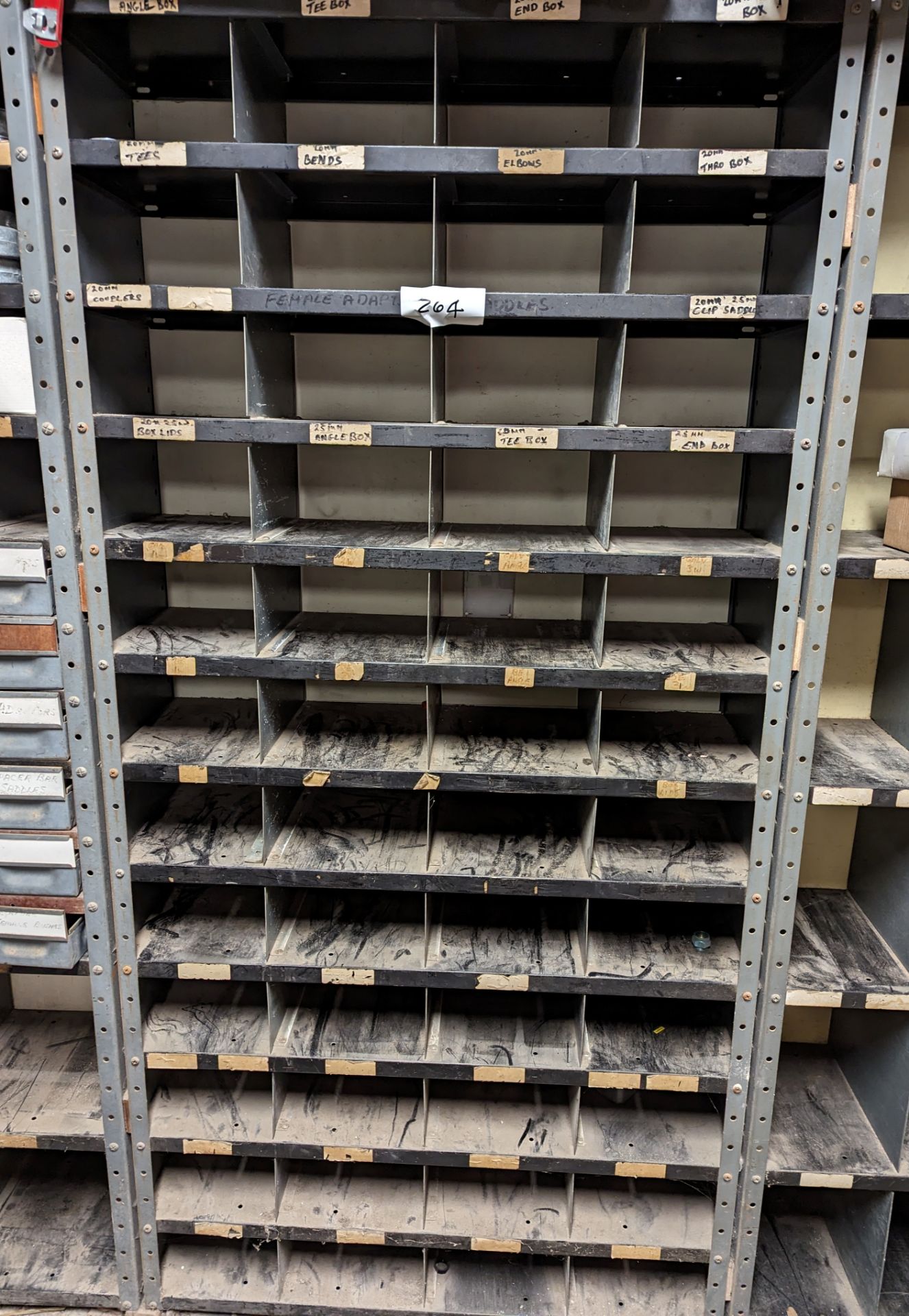 SMALL COMPARTMENT METAL STORAGE RACK (saleroom location: Frank Eastwood ...