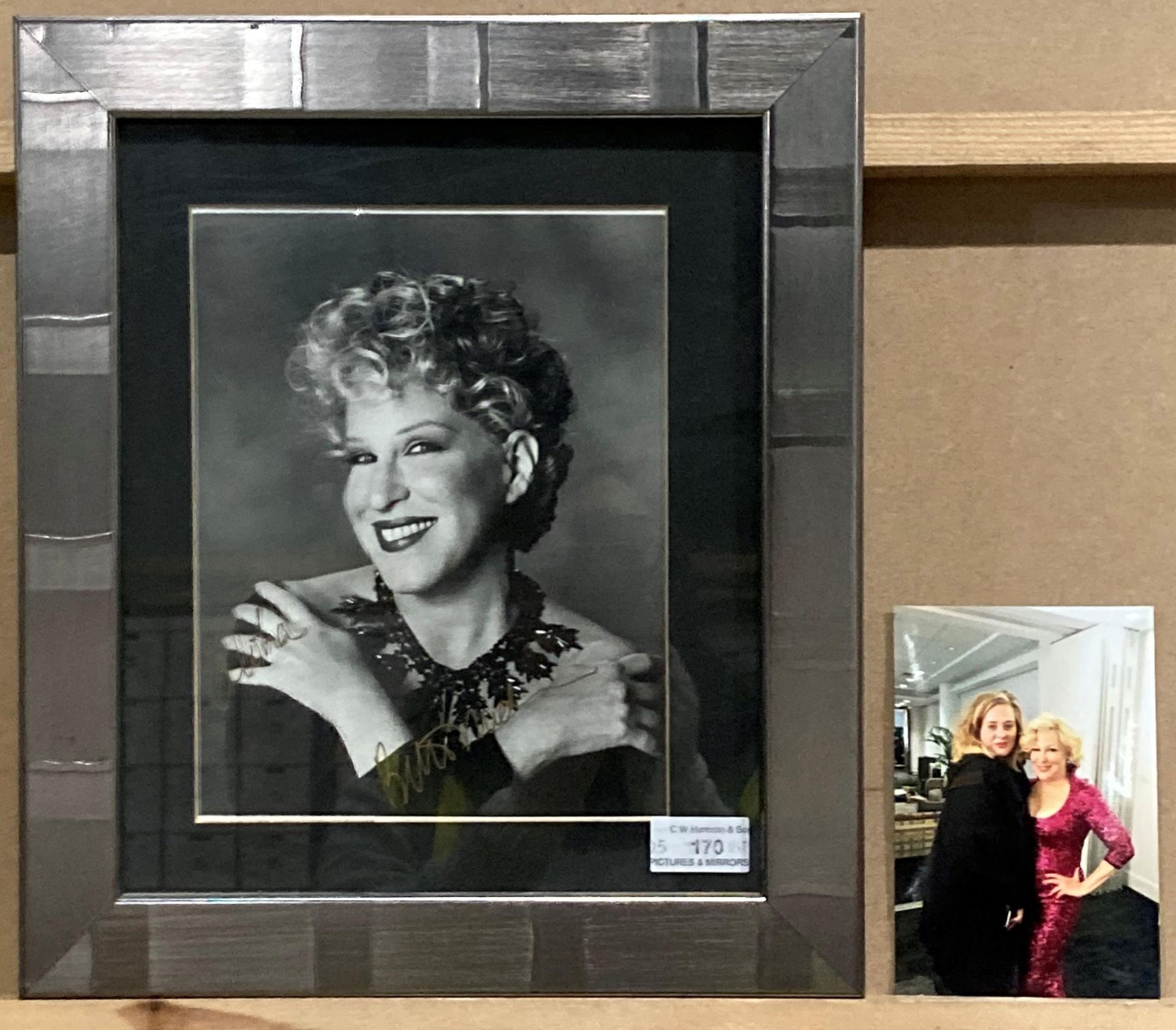 Framed photograph of Bette Midler, signed in gold pen 'Aloha Bette Midler',
