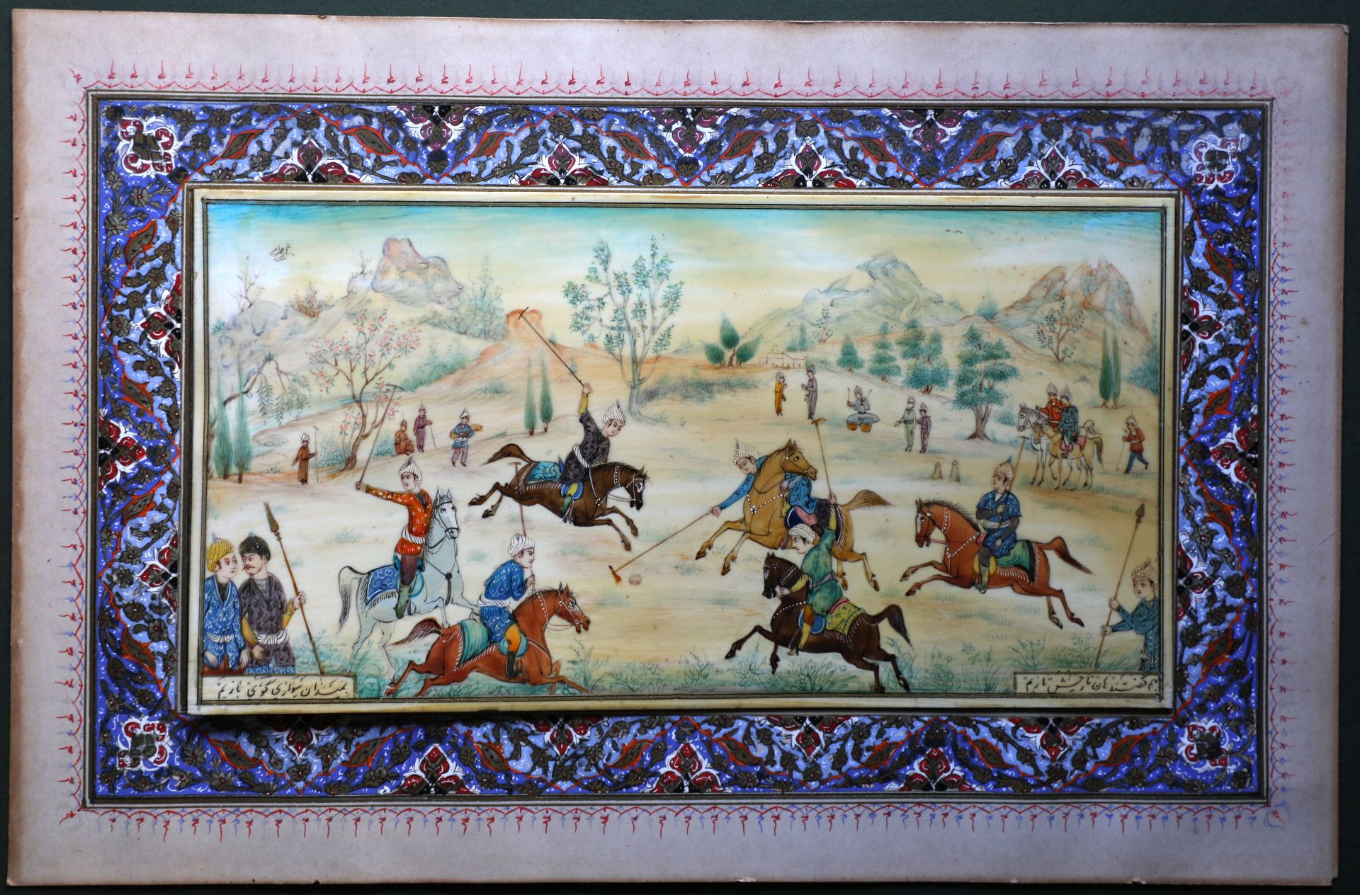 A Polo Match painted on a white panel laid on a hand pained background and an equally ornate inlaid