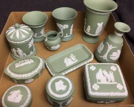 Box containing eleven pieces of Wedgwood green Jasperware including footed vase 14cm high,