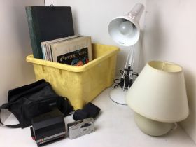 Contents to two yellow plastic boxes including anglepoise lamp, vinyl LPs and singles,