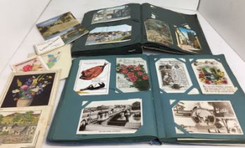 Two albums containing mainly vintage postcards and greetings cards (saleroom location Y06 2)