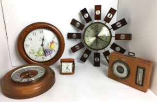 Box containing five items - five clocks including Smiths Astral wood and brass starburst 37cm