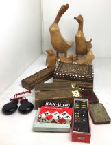 Box containing fifteen items including wooden birds 10 to 39cm high,