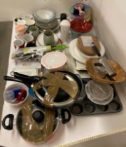 Contents to half of shelf - cooking pans, glass and ceramic bowls, mugs and kitchen crockery,