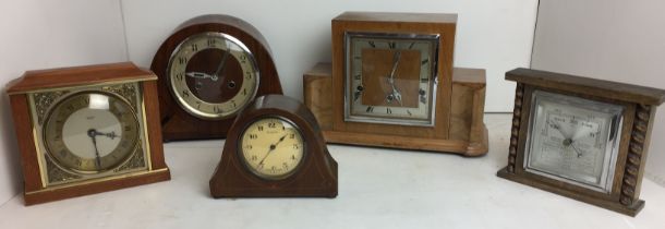 Two plastic boxes containing five items including four clocks - square mantel clock in light wood