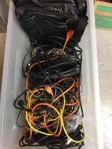 Plastic box containing assorted computer and other cables,