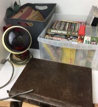 Two plastic boxes containing DVDs, 78rpm records,