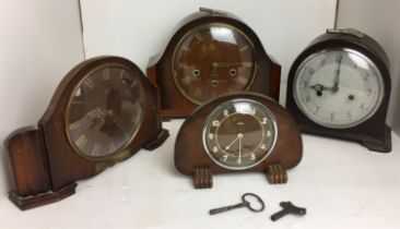 Plastic box containing four round clocks - two Smiths clocks (20cm high - white faced with key and