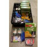 Contents to crate - assorted dog food items including dog leads, waste bags,