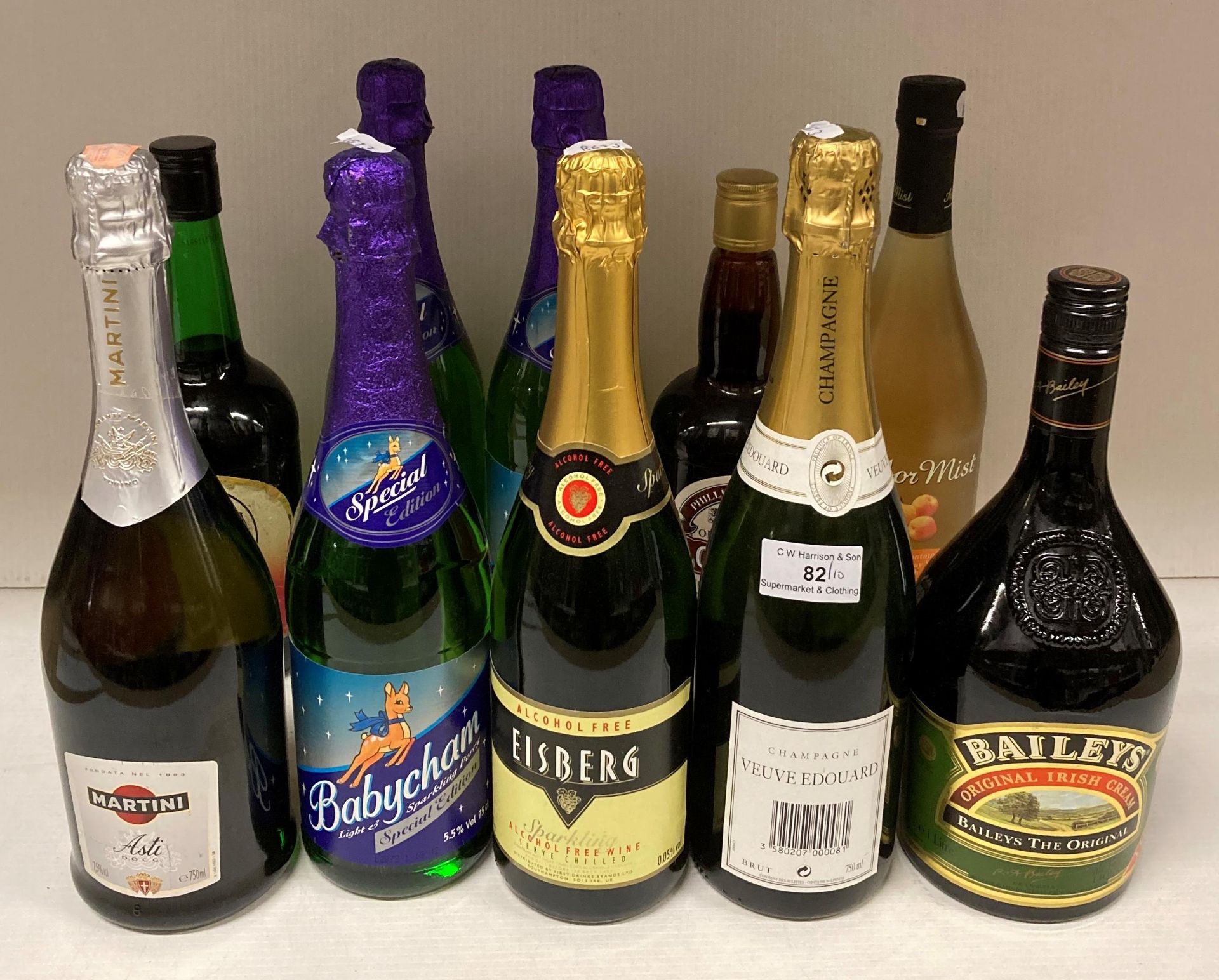 Ten assorted bottled including a 750ml bottle of Veuve Edouard Brut Champagne, Asti Martini,