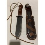 British Military type 'D' survival knife with leather sheath and stamped to wooden handle,